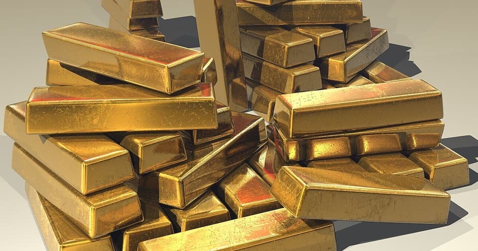 3D rendering of gold bars, stacked investment gold