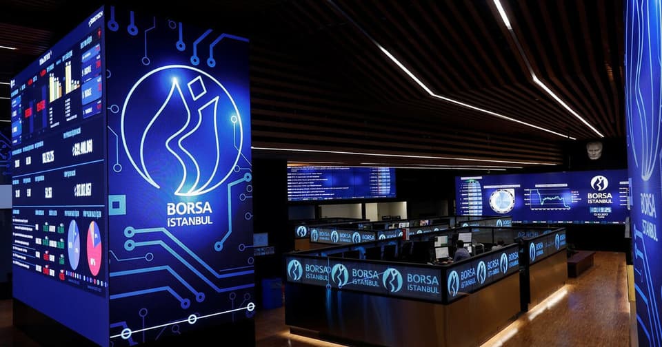 Interior view of the Borsa Istanbul (BIST) trading floor with blue neon lighting and data-driven screens.