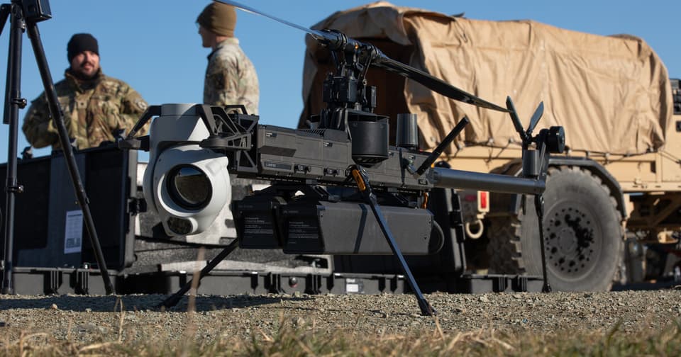 Testing of a defense technology system in a military field, alongside technicians and personnel
